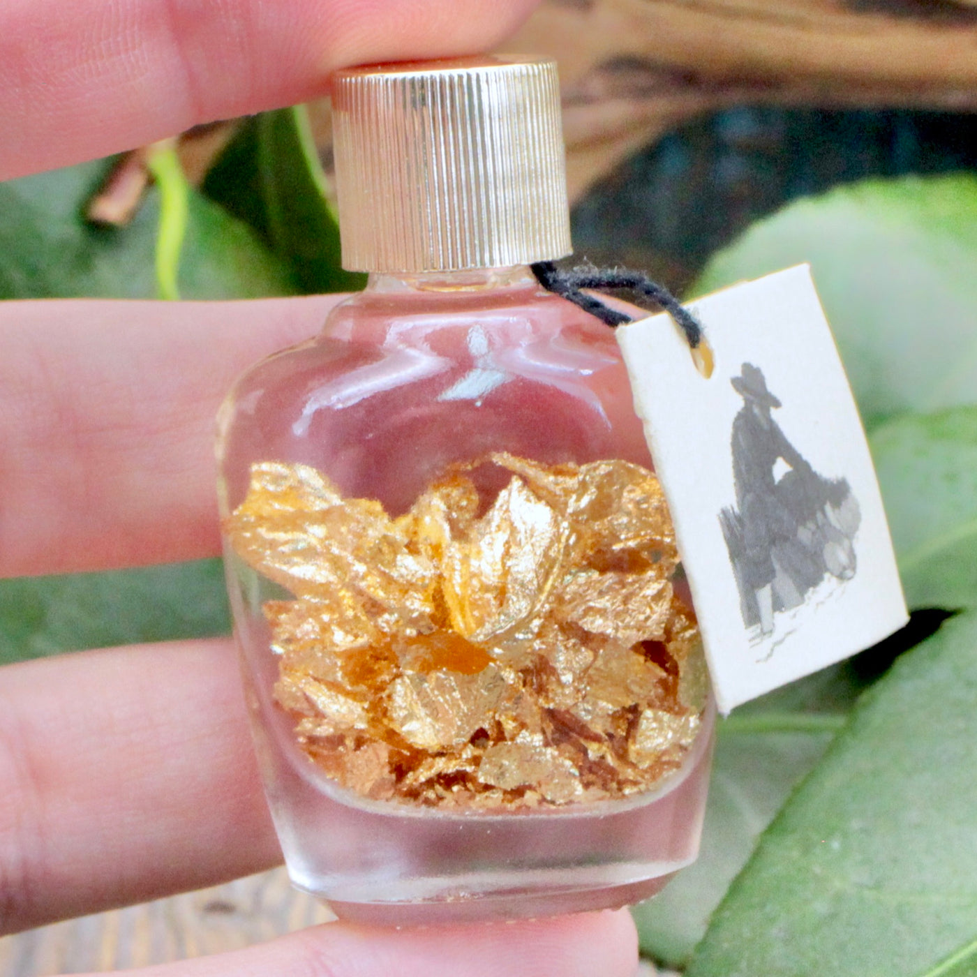 Gold Flakes in Bottle